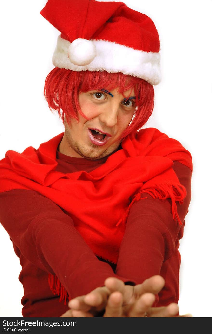 Humorous scene of a young man playing Father Christmas with red wig. Humorous scene of a young man playing Father Christmas with red wig