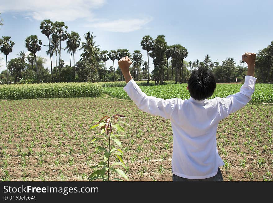 Man relief at corn farm in tropical hot day. Man relief at corn farm in tropical hot day