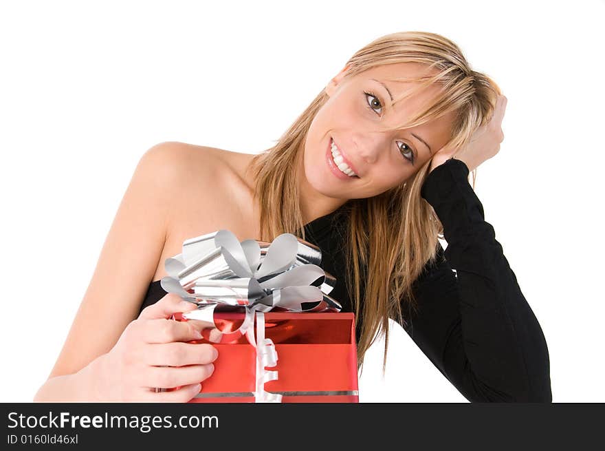 Happy young woman looks at the camera with red gift. Isolated image on white background. Happy young woman looks at the camera with red gift. Isolated image on white background