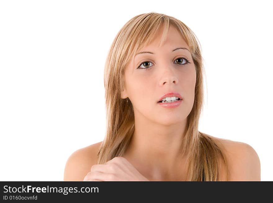 Blond girl looks at the camera and touching her hair. Isolated image on white background. Blond girl looks at the camera and touching her hair. Isolated image on white background