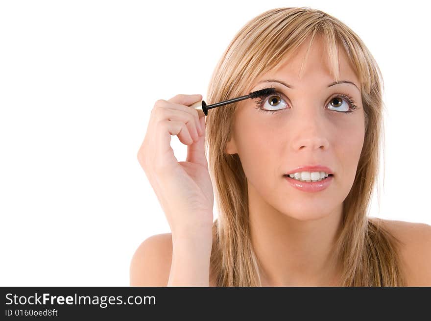 Beautiful girl applying mascara on the eyelashes. Beautiful girl applying mascara on the eyelashes