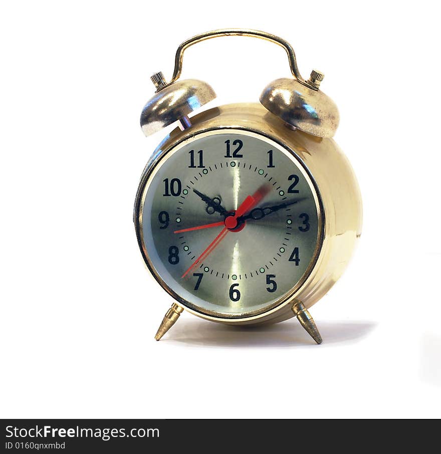 Old-styled gold alarm clock isolated on white