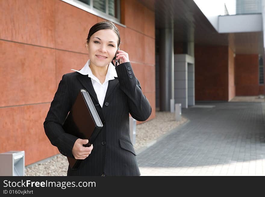 Attractive brunette and successful businesswoman. Attractive brunette and successful businesswoman