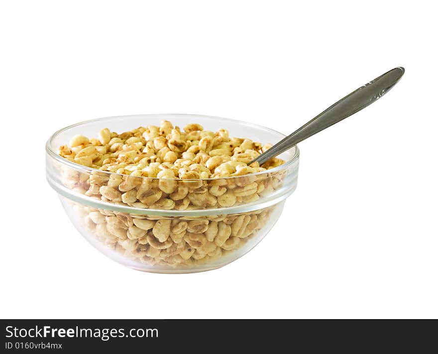 A glass bowl full of popped rice. A glass bowl full of popped rice