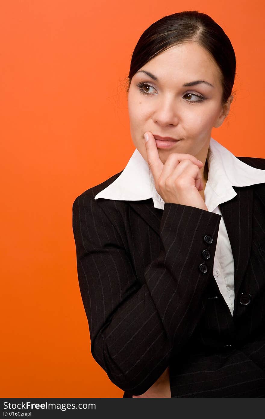 Attractive brunette businesswoman. Over orange background