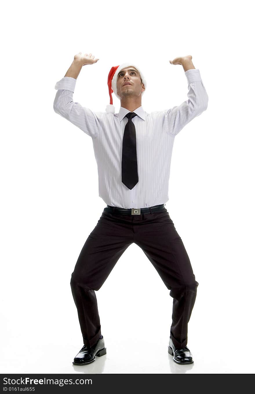 Young businessman looking upward against white background