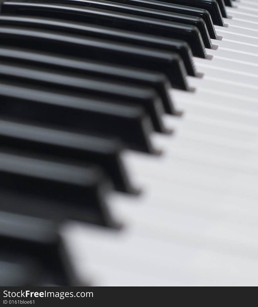 angled close up of musical keyboard showing notes. angled close up of musical keyboard showing notes