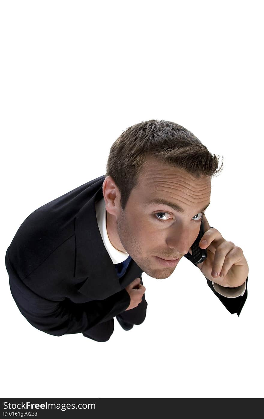 Businessman busy on phone call and looking upwards