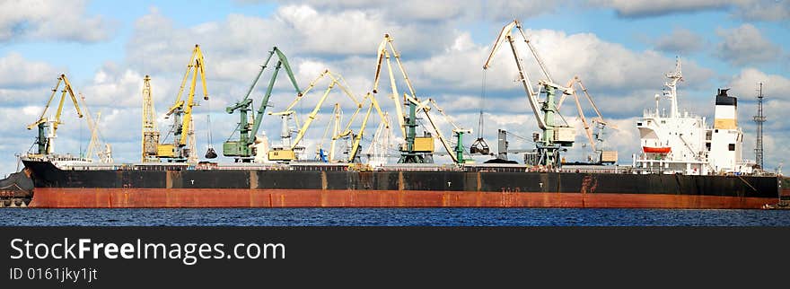 Loading by coal of the cargo ship in the Riga port. Loading by coal of the cargo ship in the Riga port.