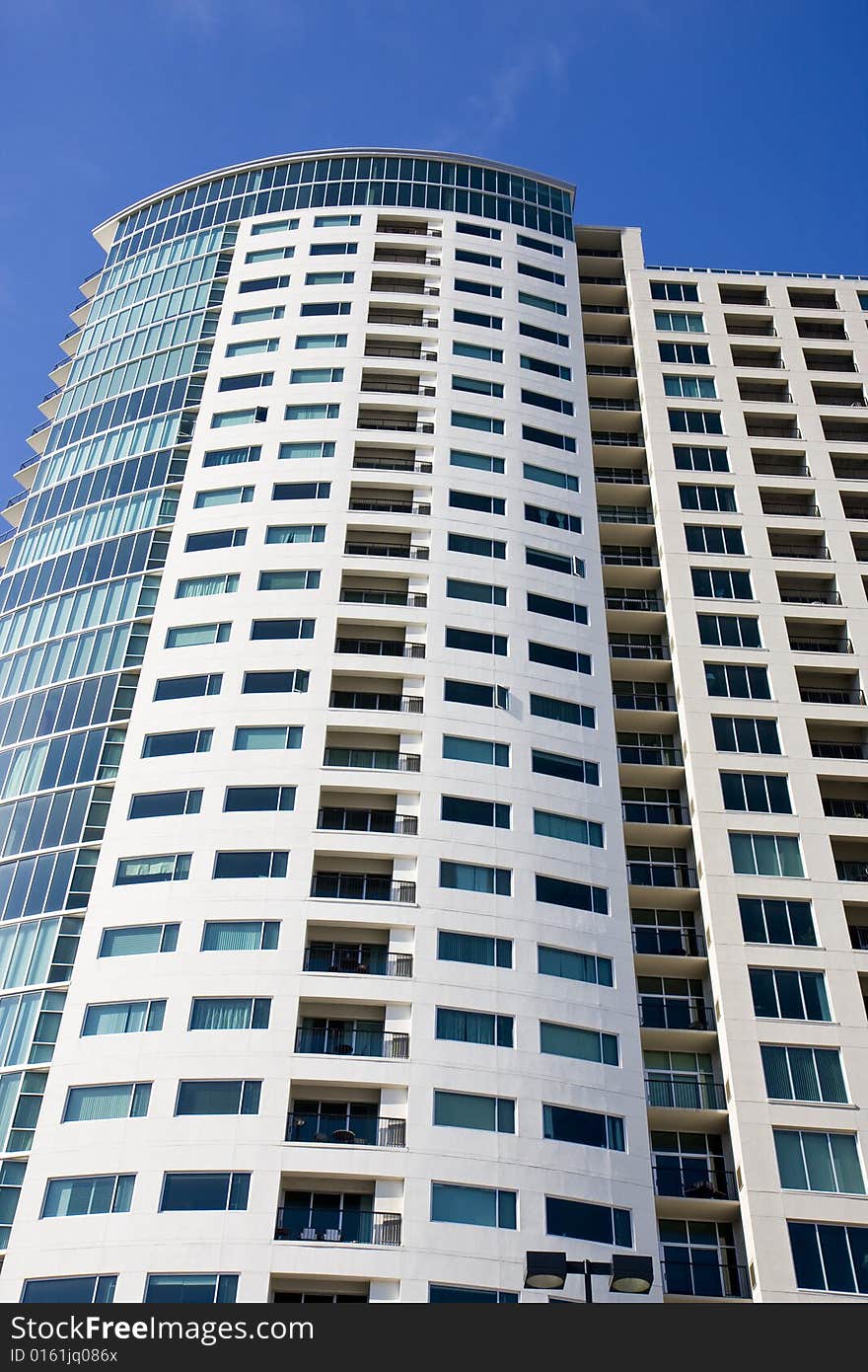 Condo Tower Balconies into Blue Sky