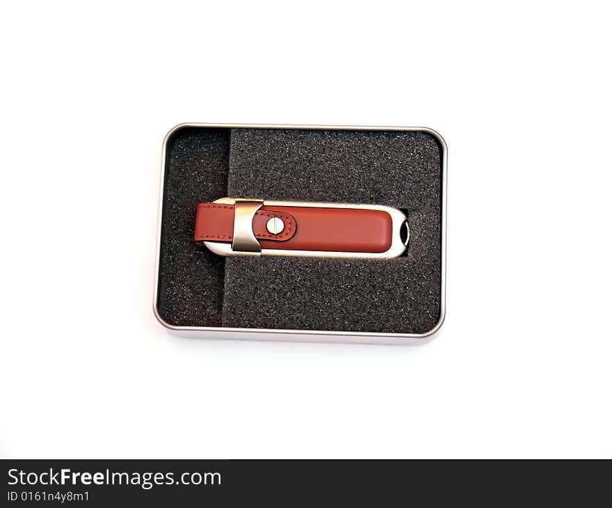 Close up of the elegant usb flash memory in the metal box, isolated on white background. Close up of the elegant usb flash memory in the metal box, isolated on white background.