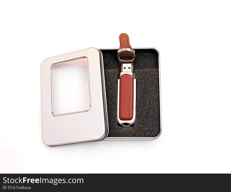 Close up of the elegant usb flash memory in the metal box, isolated on white background. Close up of the elegant usb flash memory in the metal box, isolated on white background.