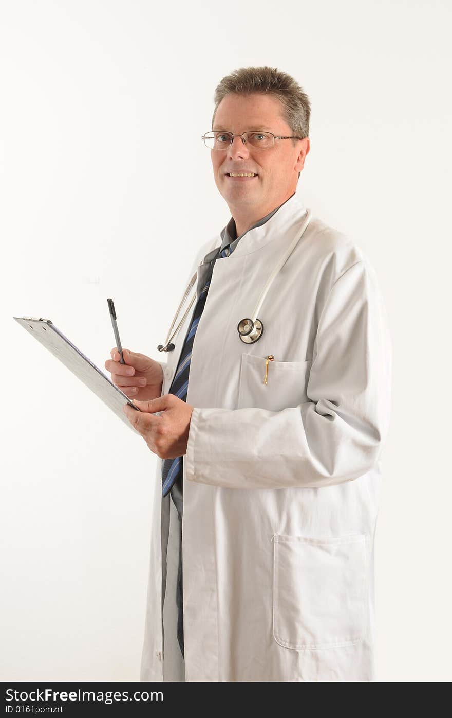 Doctor at the clinic, doing his paperwork on a clipboard. Isolated over white. Doctor at the clinic, doing his paperwork on a clipboard. Isolated over white.