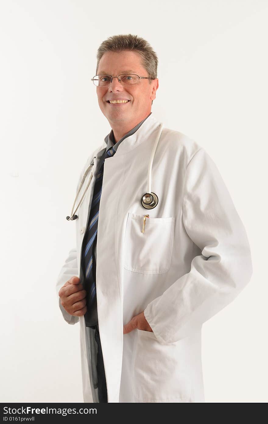 Doctor at the clinic, doing his paperwork on a clipboard. Isolated over white. Doctor at the clinic, doing his paperwork on a clipboard. Isolated over white.