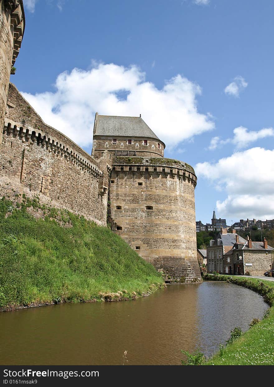 Tower of an ancient castle and protecting ditch with water. Tower of an ancient castle and protecting ditch with water