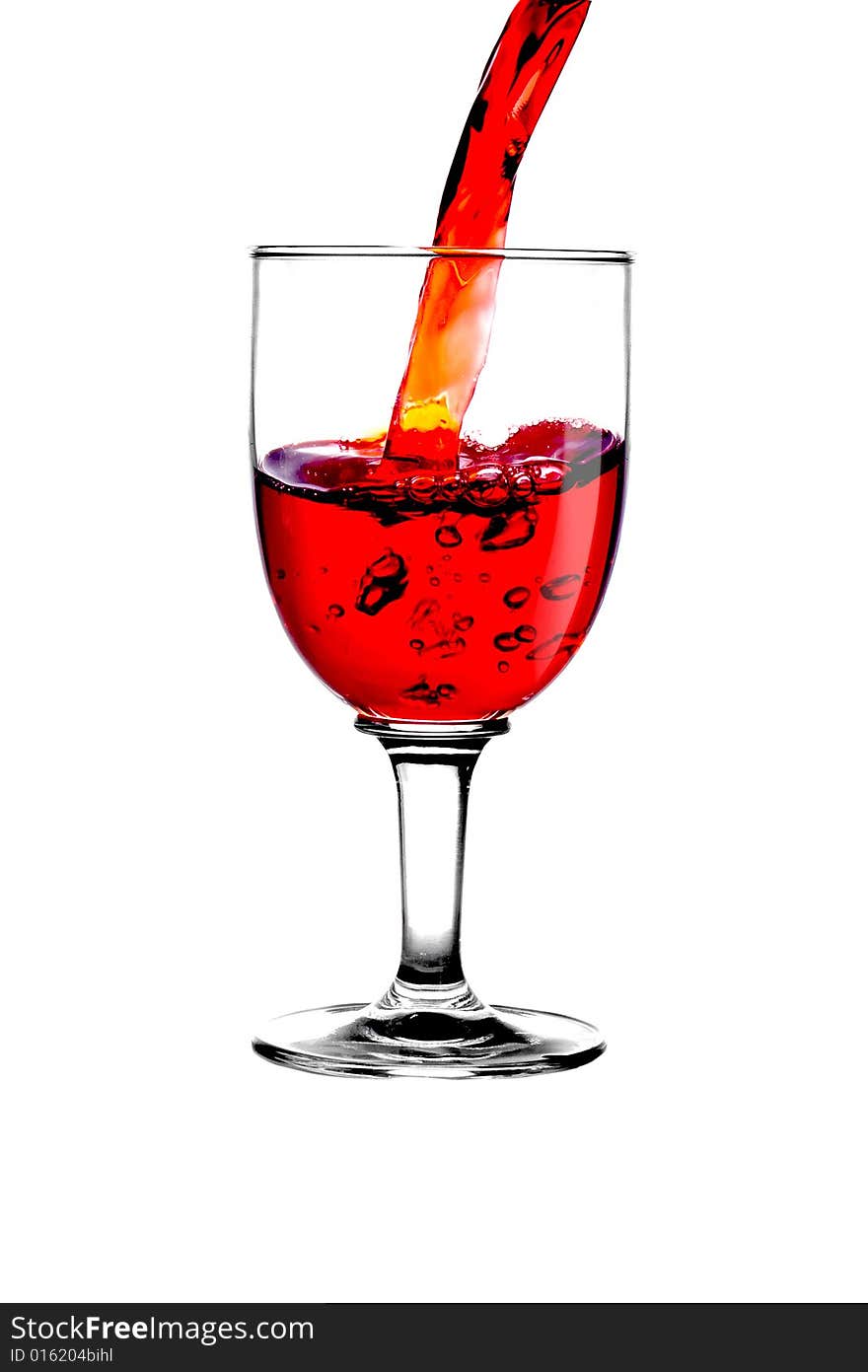 Stream red wine in glass