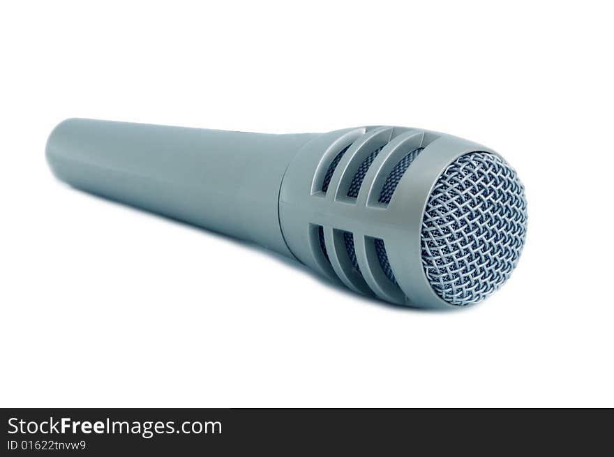 Dynamic microphone for karaoke and plug connector against white,  blue toned