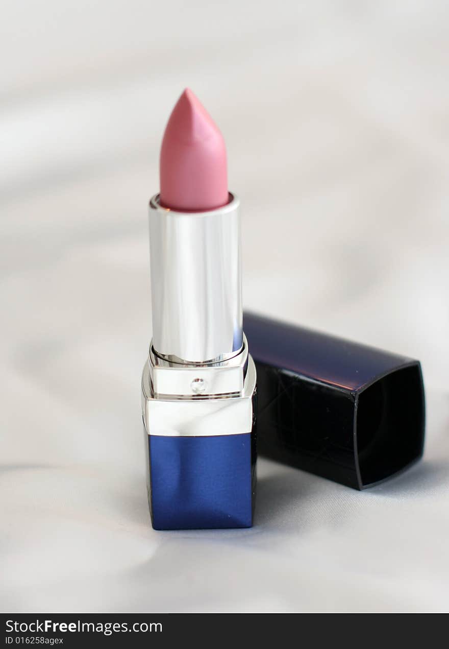 Close-up of a lipstick over white background. Close-up of a lipstick over white background