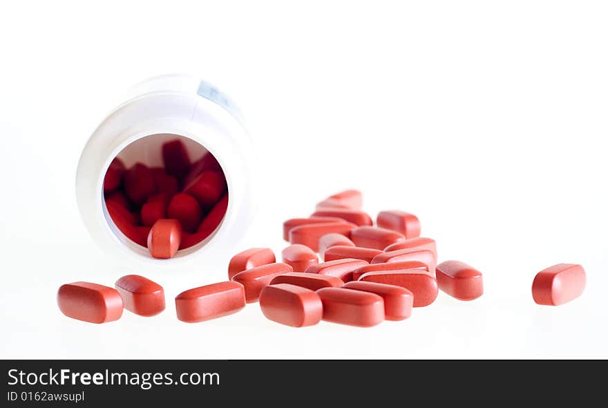 Red Pills isolated on white background