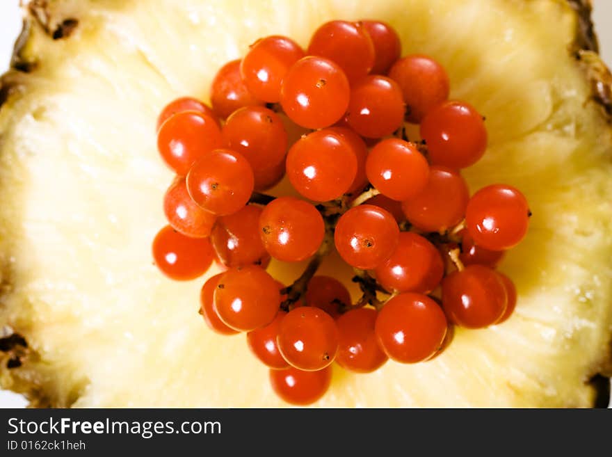 Fresh red berries on pineapple