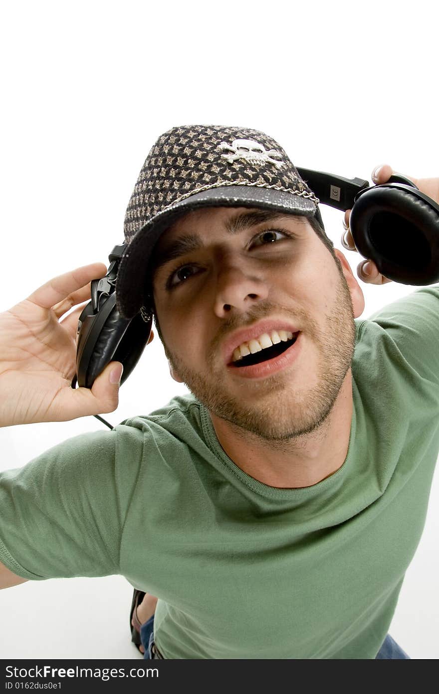 Male holding headphone with white background