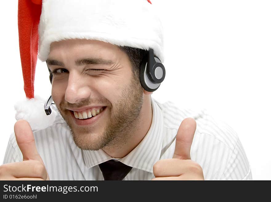 Happy businessman posing with cheer up and wearing santa cap