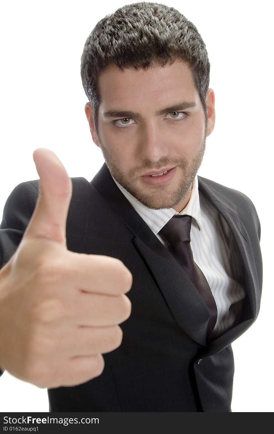 Attractive businessman showing thumbs up