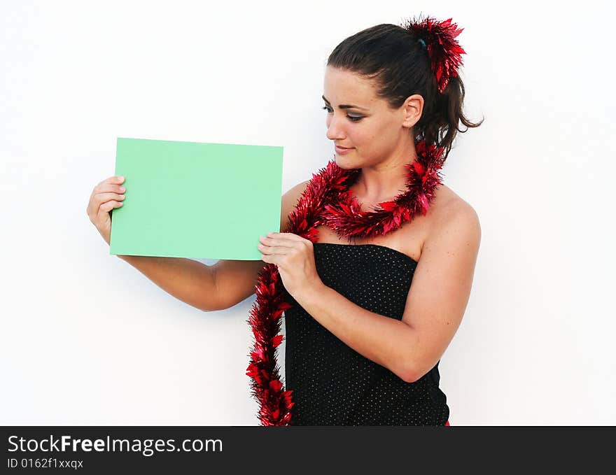 Beautiful woman holding a green card for Christmas. Beautiful woman holding a green card for Christmas.