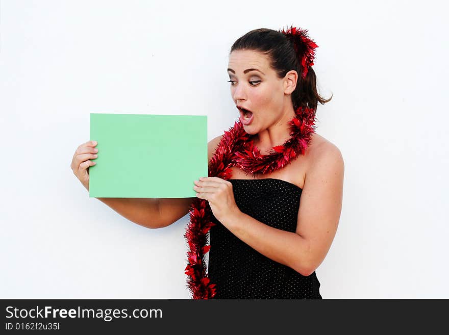 Beautiful woman holding a green card for Christmas. Beautiful woman holding a green card for Christmas.