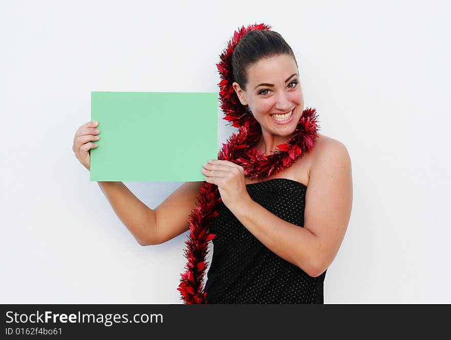 Beautiful woman holding a green card for Christmas. Beautiful woman holding a green card for Christmas.