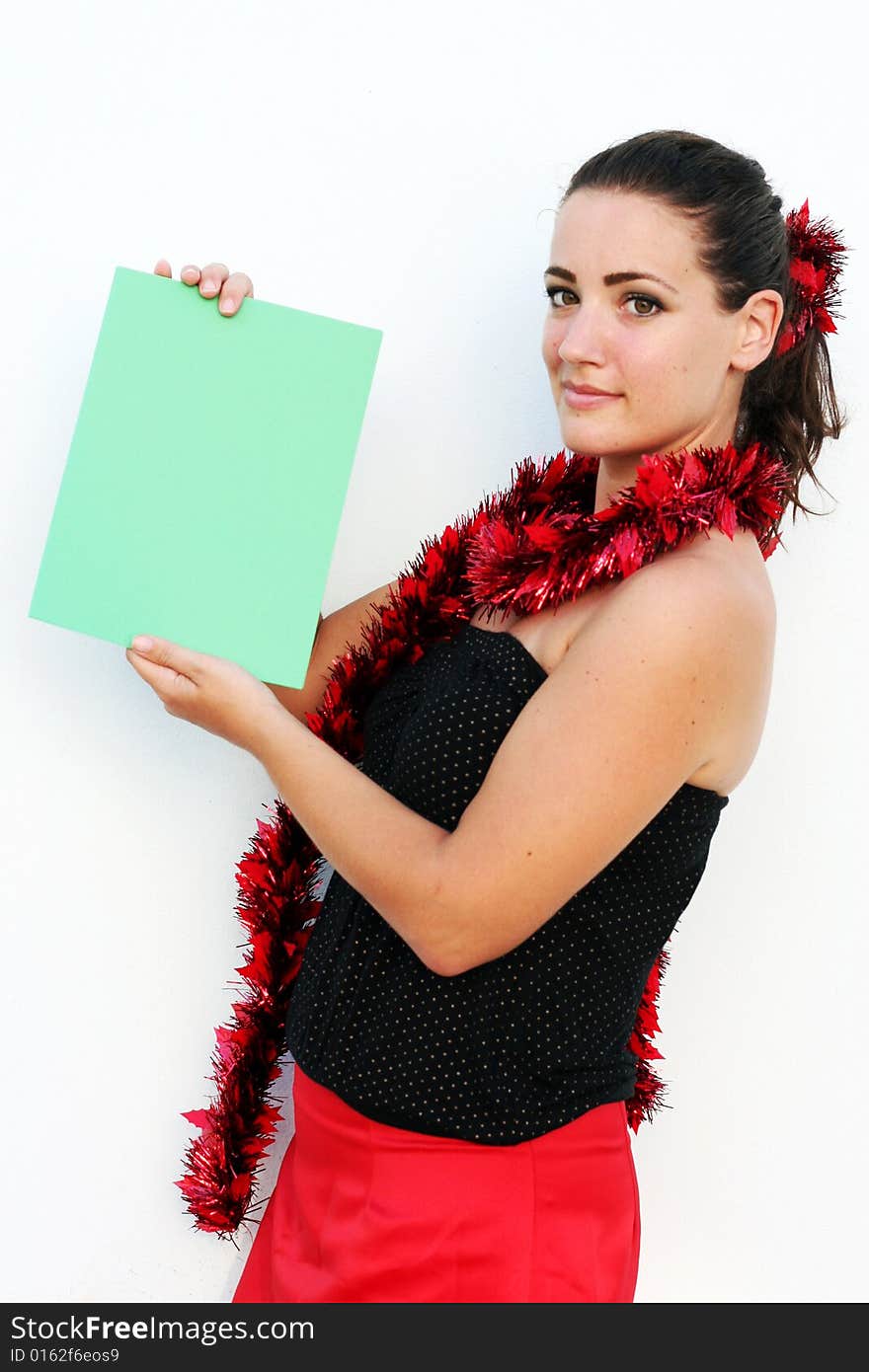 Beautiful woman holding a green card for Christmas. Beautiful woman holding a green card for Christmas.