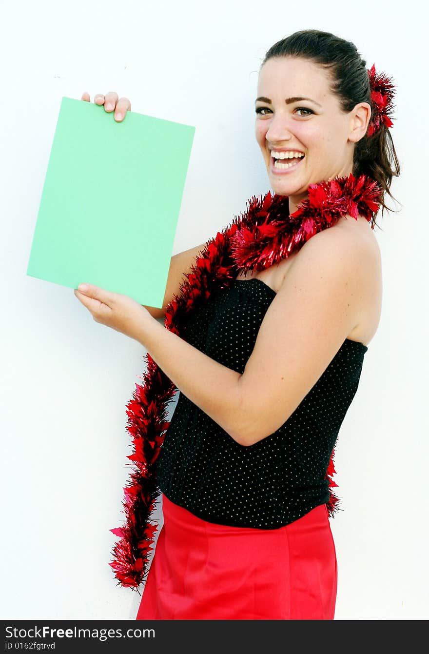 Beautiful woman holding a green card for Christmas. Beautiful woman holding a green card for Christmas.