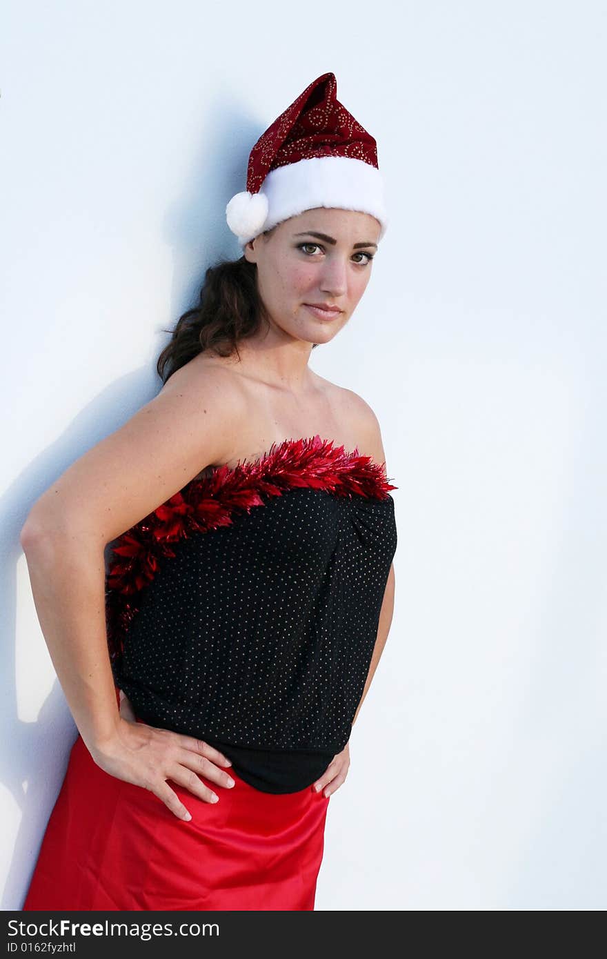 Beautiful young woman dressed in a festive Christmas outfit. Beautiful young woman dressed in a festive Christmas outfit.