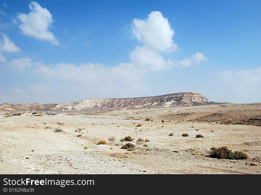 Fragment of Judaic desert with mountains on a distance shot. Fragment of Judaic desert with mountains on a distance shot