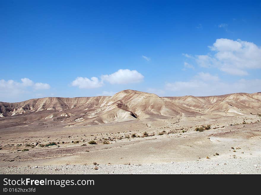 Fragment of Judaic desert with mountains on a distance shot. Fragment of Judaic desert with mountains on a distance shot