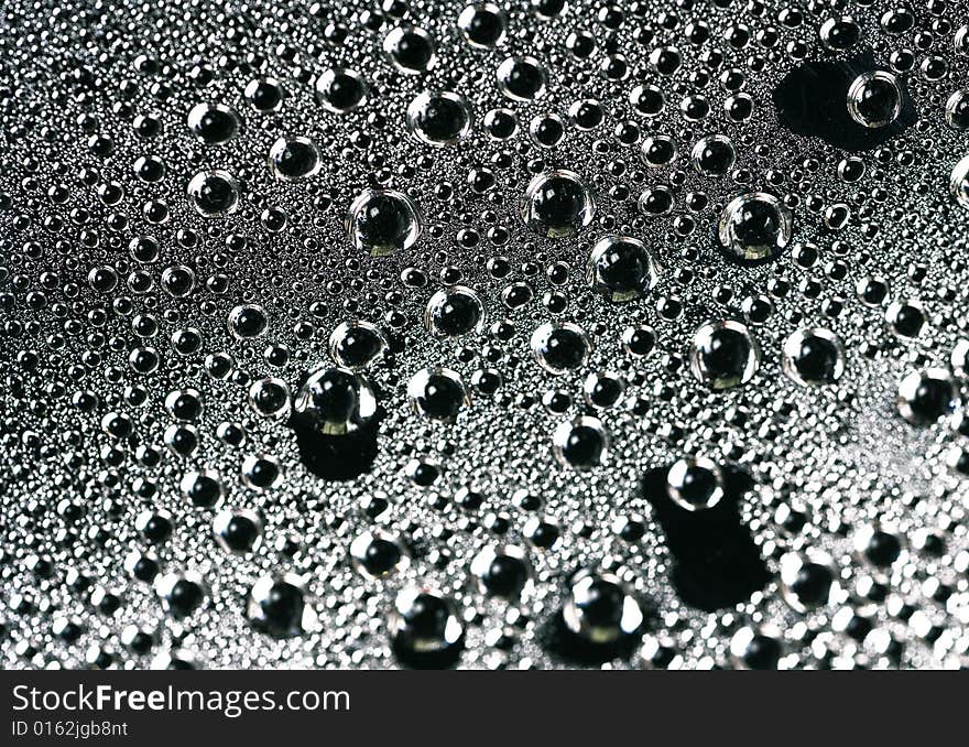 Water drops on black background