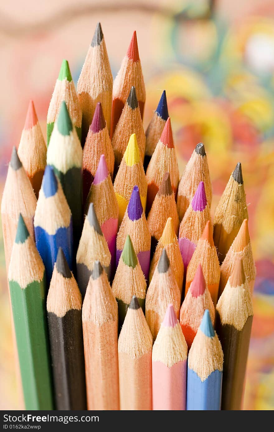 Color pencils isolated on color background. Color pencils isolated on color background