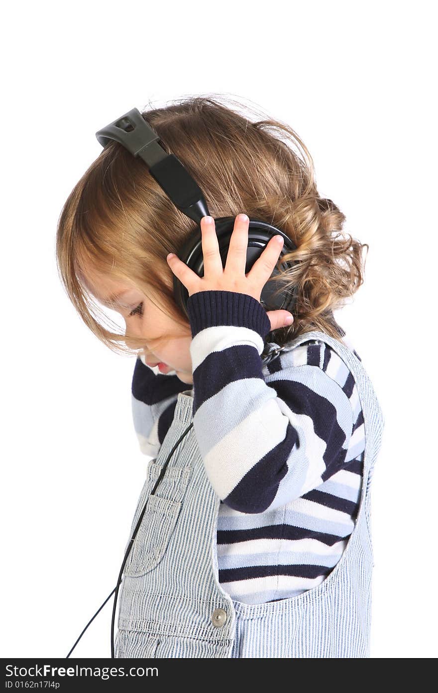 Beauty a little girl listening music on white background