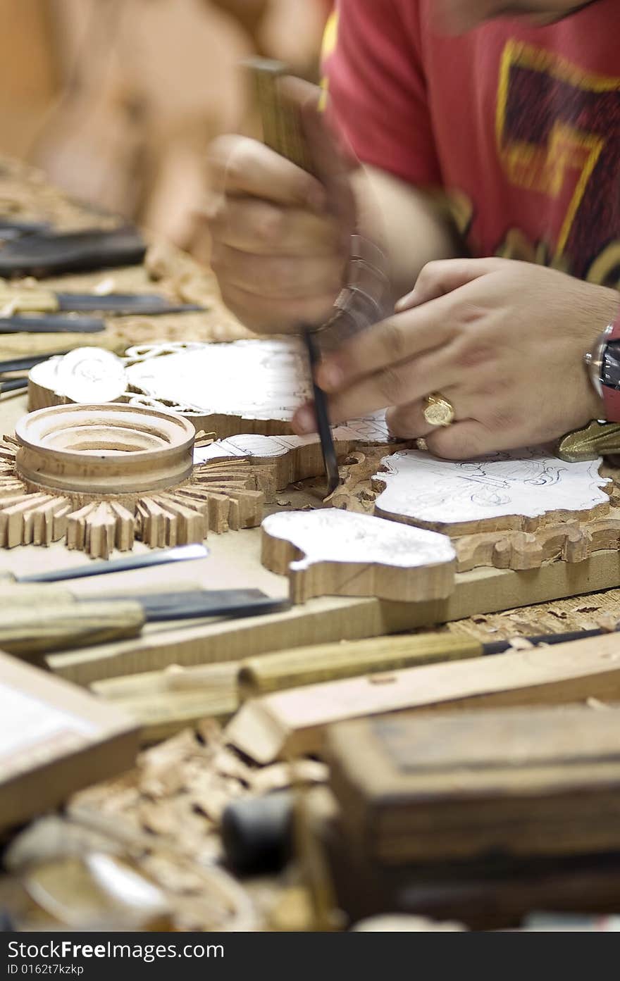 Detail of a craftsman of the wood working on a piece