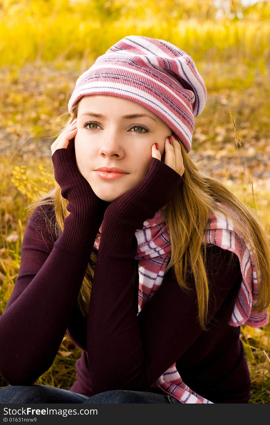 Beautiful thoughtful girl in the park