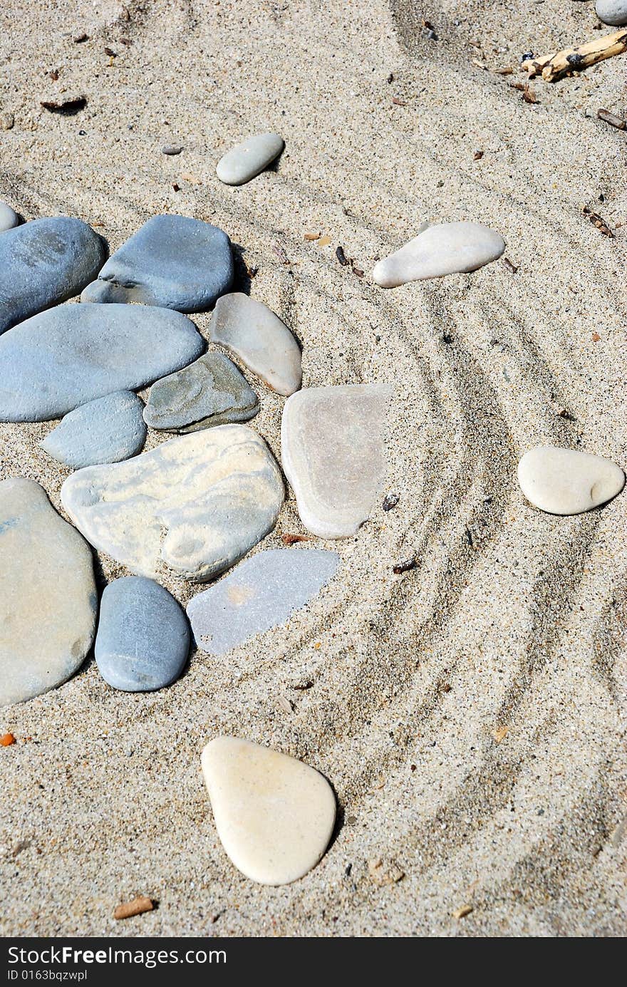 Stones on sand