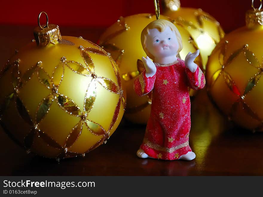 Close-up of glass balls and a clay angel. Close-up of glass balls and a clay angel