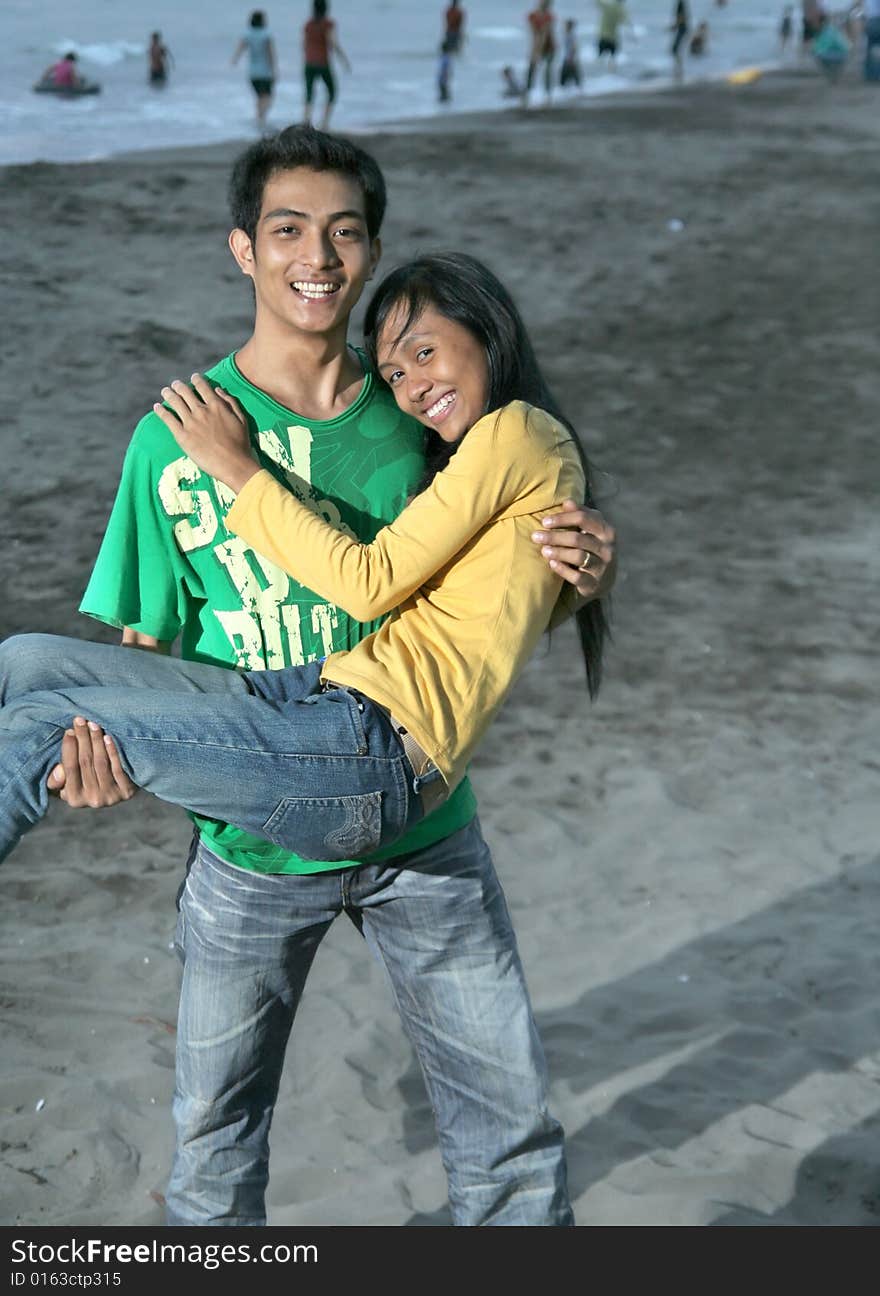 Couple fun on beach at evening. Couple fun on beach at evening