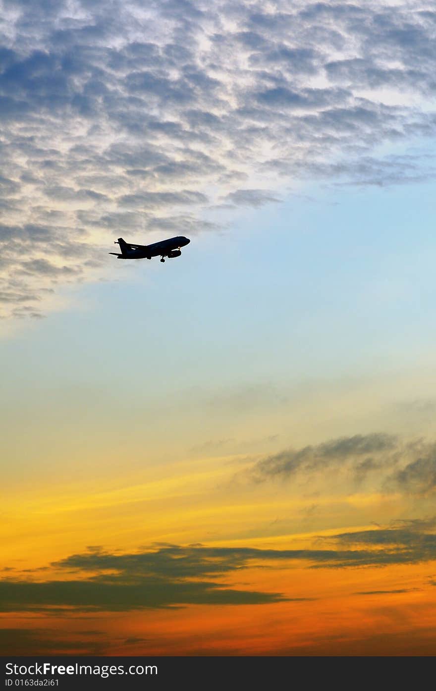 Plane flying pass sunrise