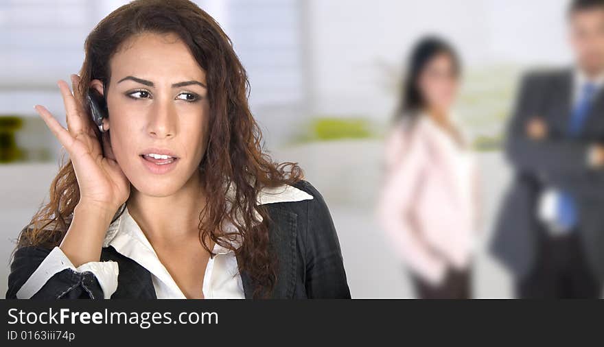 Young businesswoman with people in the background