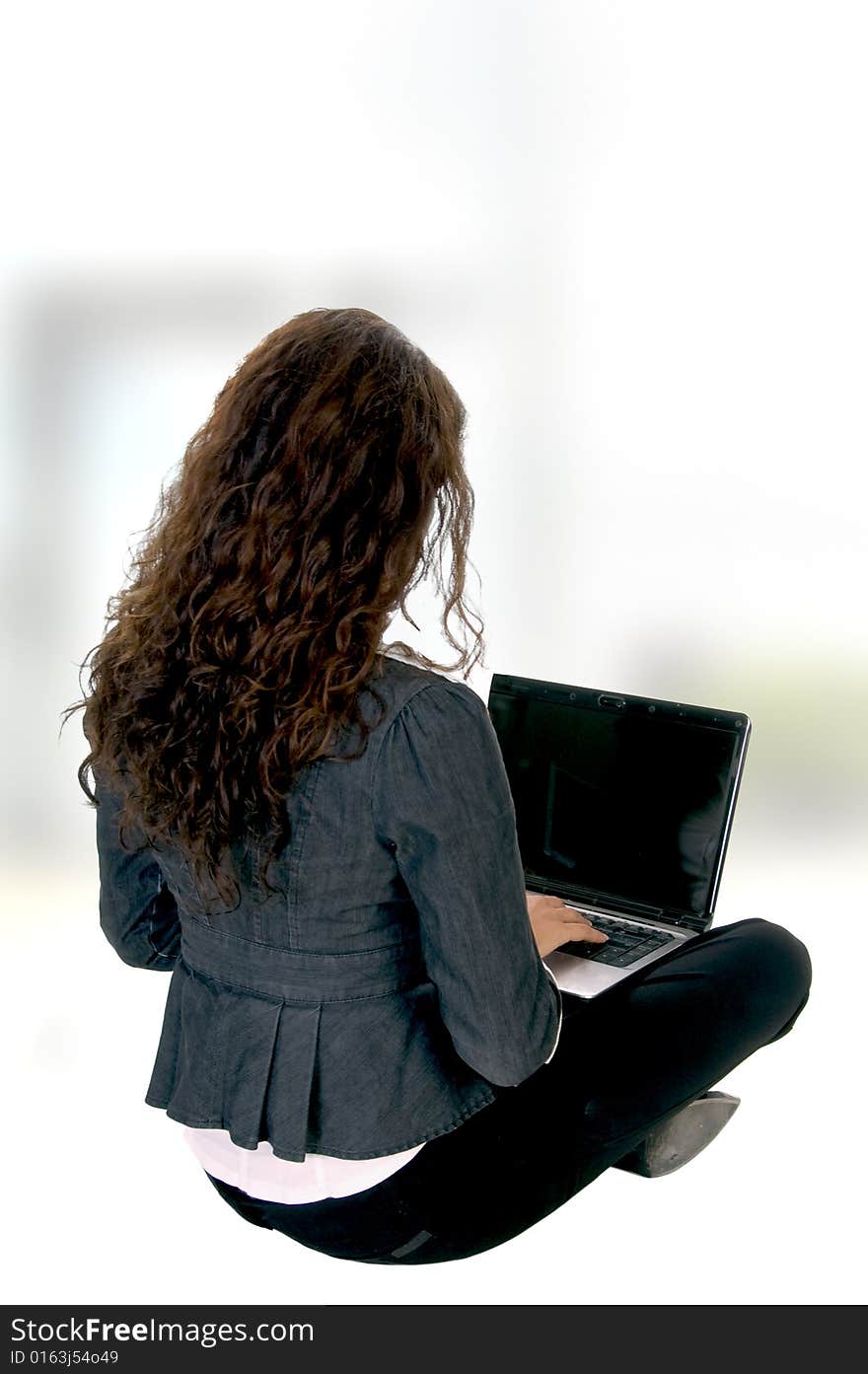 Female busy with laptop on an abstract  background