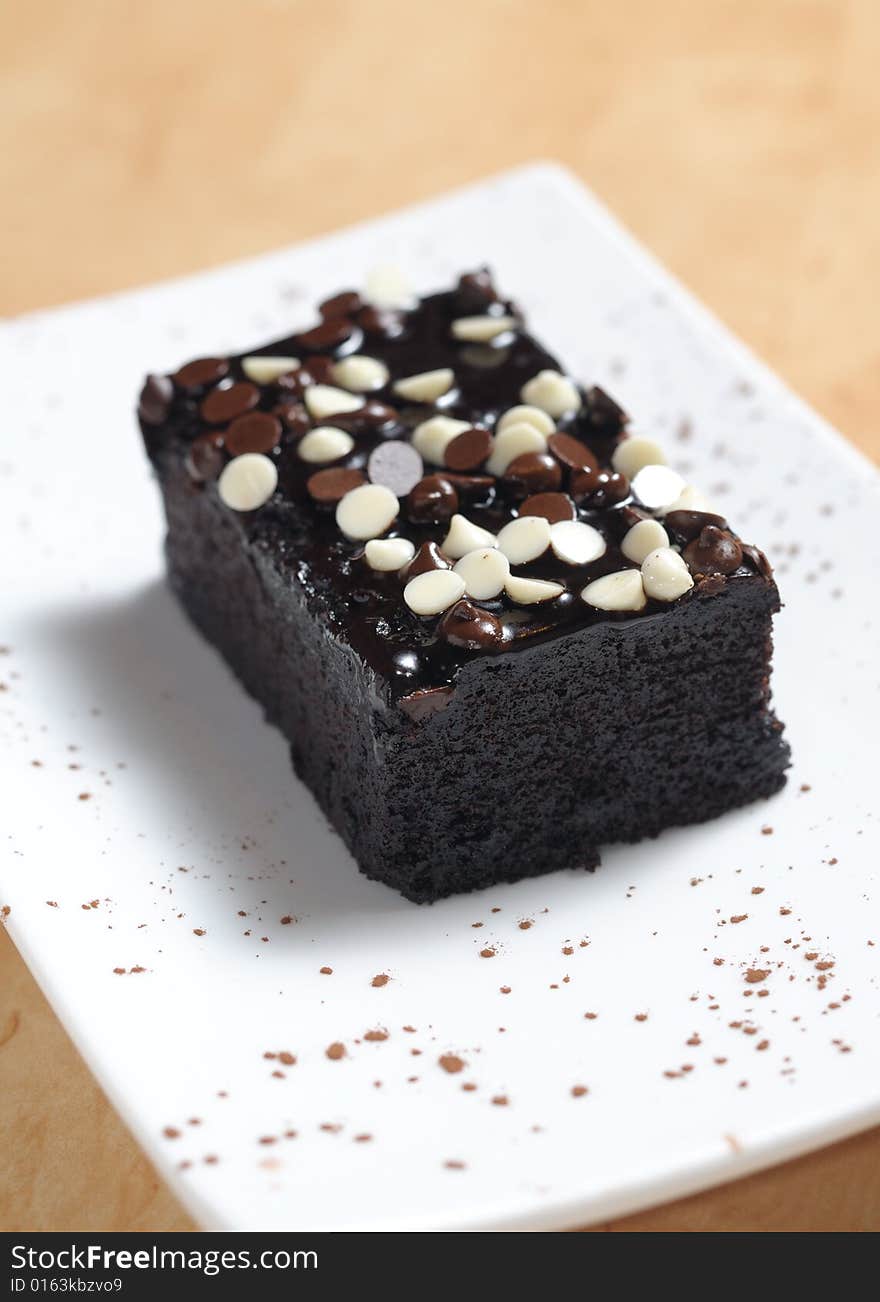 Brownie served on a white plate. Brownie served on a white plate