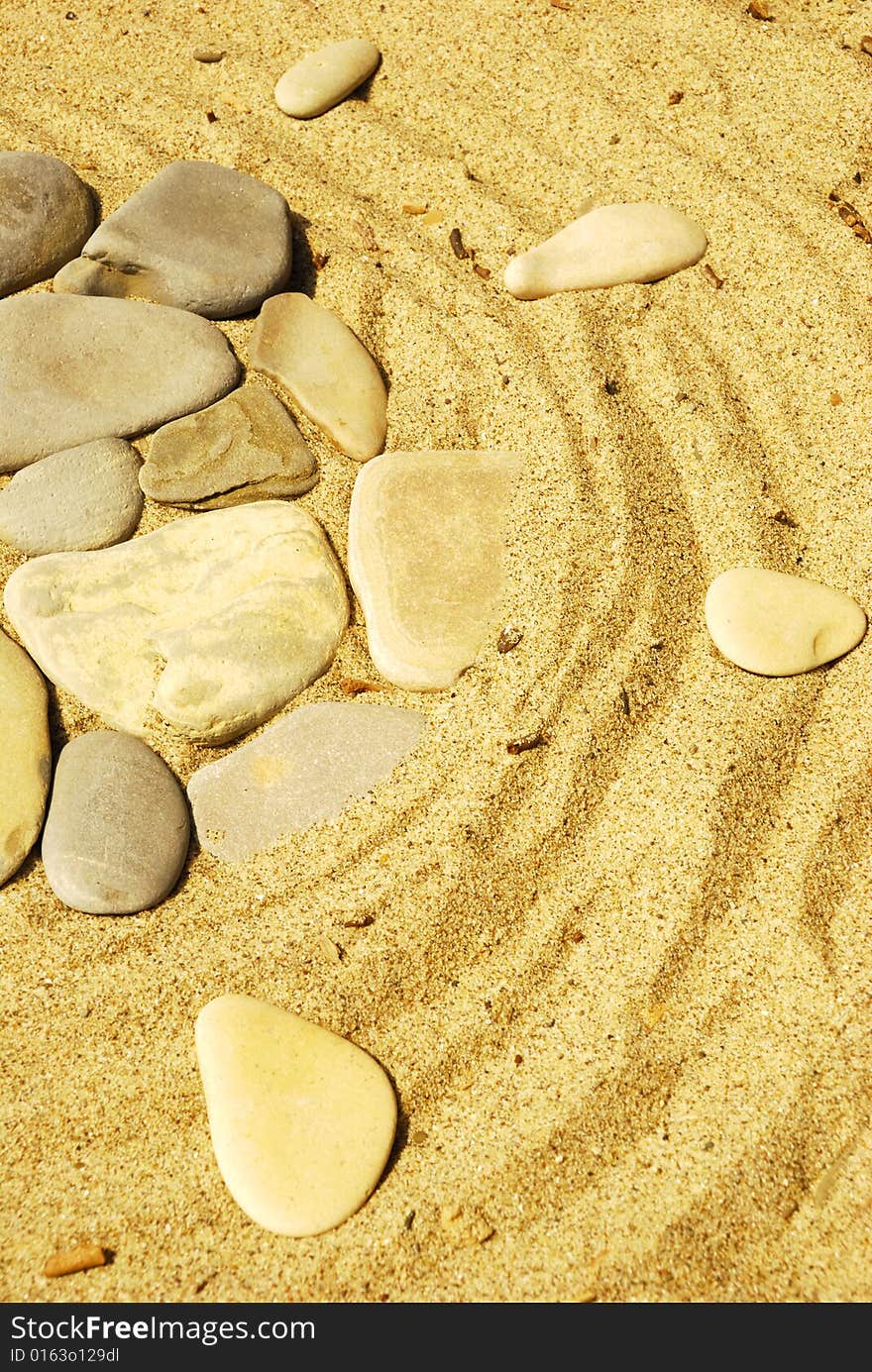 Stones on sand