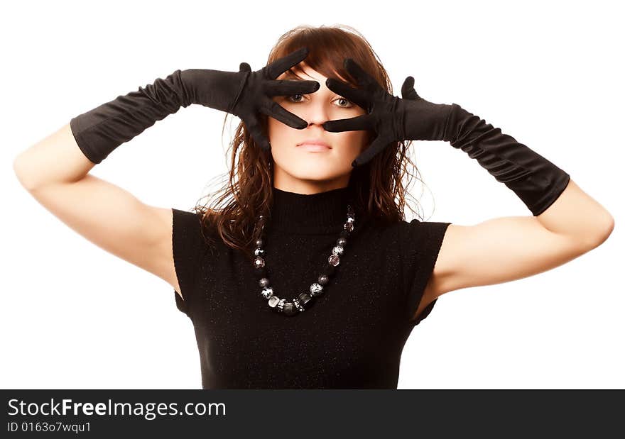 The girl in black clothes on a white background with a hat hat