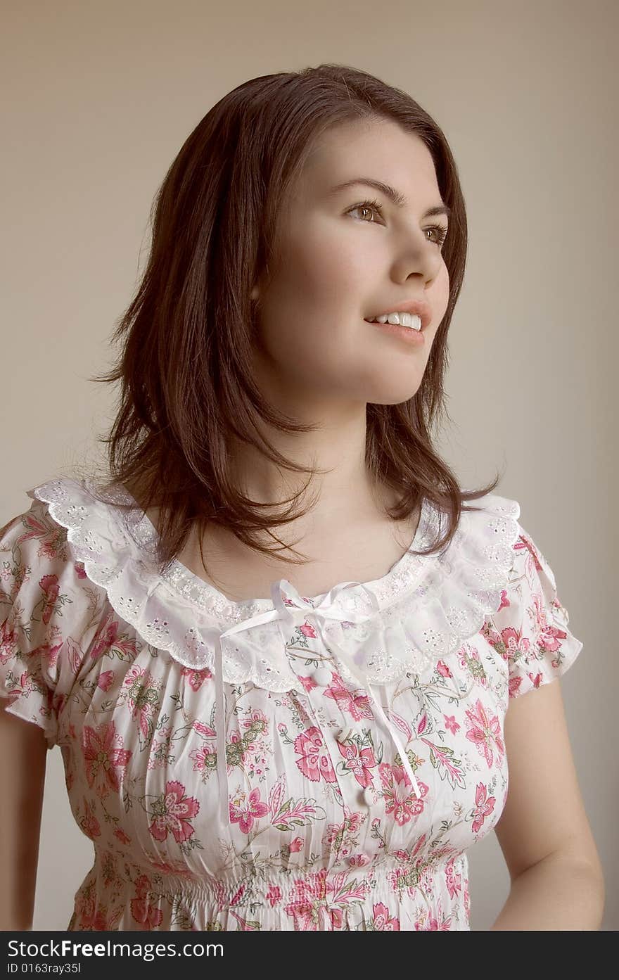 A beautiful young woman in white dress. A beautiful young woman in white dress